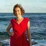 Lourdes Starshower in a red dress at the sea side