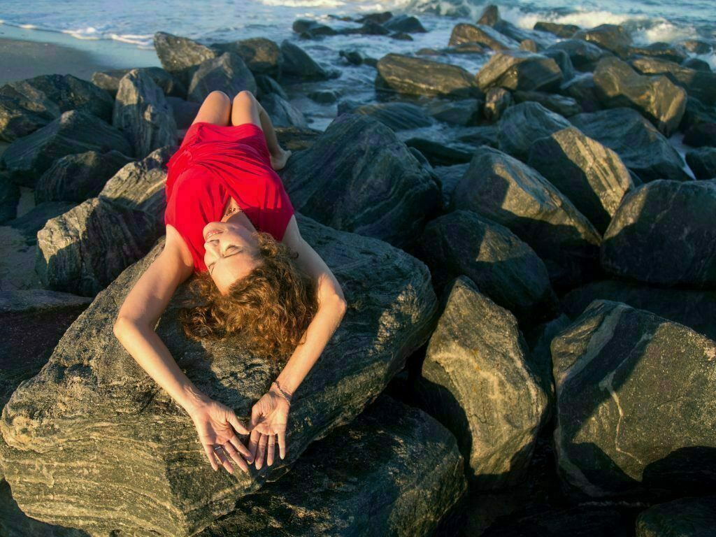 Laying on a rock at the beach