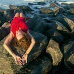 Laying on a rock at the beach