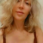 Laurie with long blond hair showcasing Sensual Healing Touch