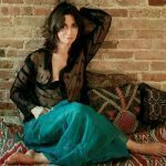 Looking relaxed and sitting against the wall