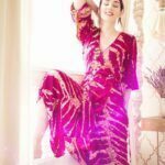 Dakini Aurora Rose in a beautiful redish pinkish dress