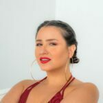 GAIA sitting in a red top