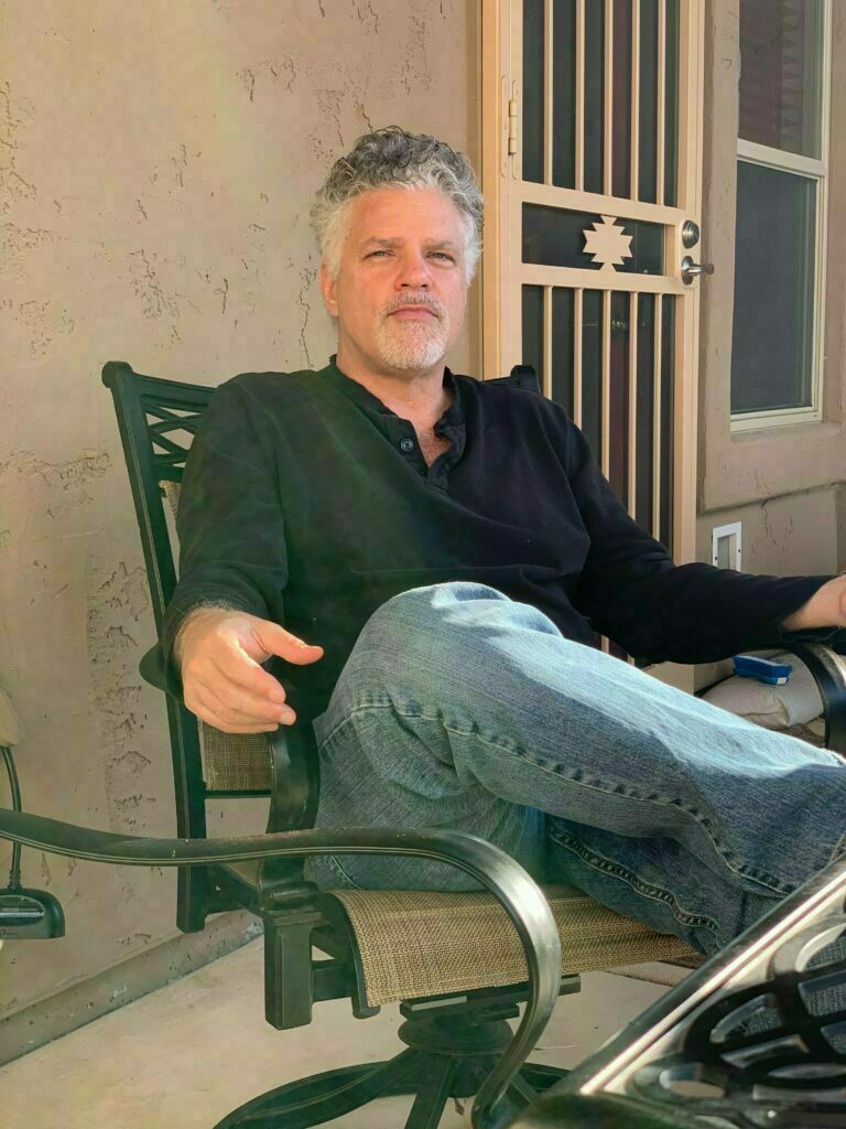 Sitting on a chair looking relaxed