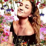 Elle smalling the flowers