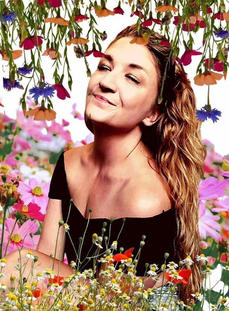 Elle smalling the flowers