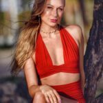 Alaya in a red outfit