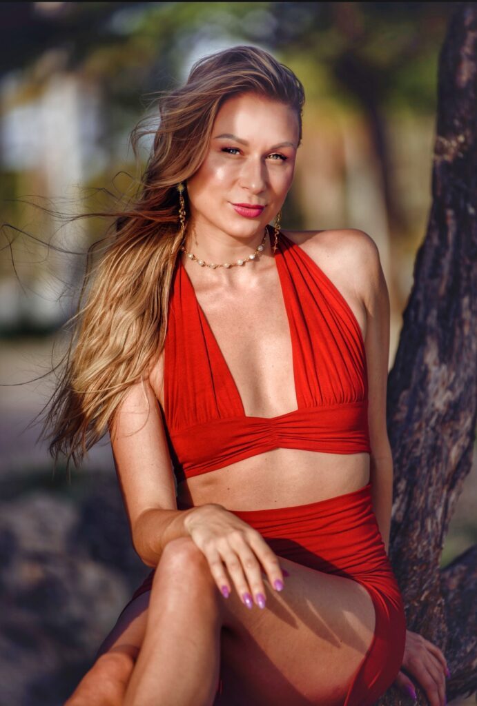 Alaya in a red outfit