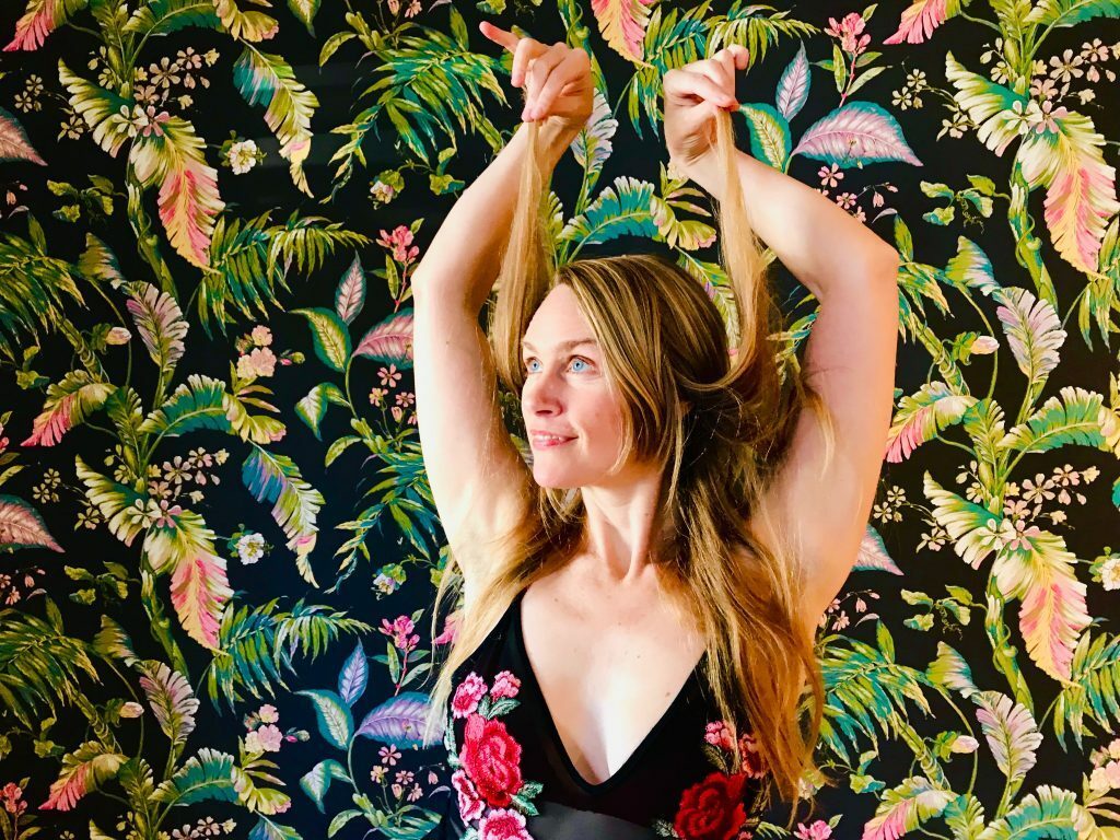 Heidi holding her hair