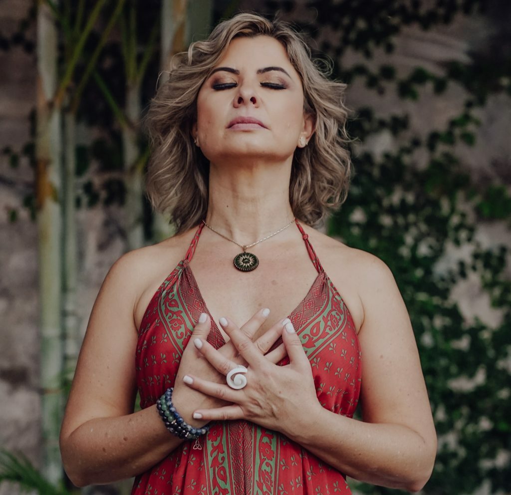 Simone holding her hands over her chest
