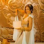 Angela playing on a white crystal singing bowl.