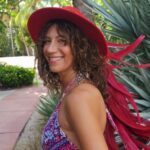 TantrAnna wearing a big red hat