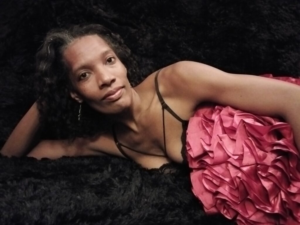 Jasmine Heart laying on her side in pink