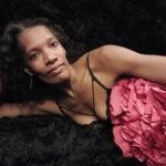 Jasmine Heart laying on her side in pink