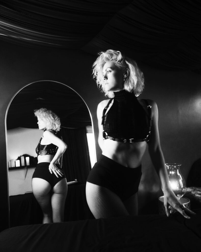 Standing next to a mirror
