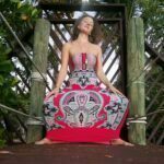 Rae Preston in a dress half squatting