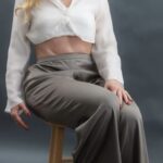 Anastasia sitting on a stool