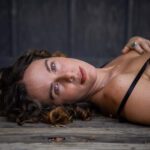 Close up of her face lying down.