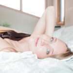 Lying on the bed looking at the camera