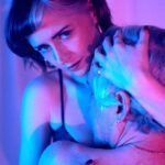 Mistress Em holding a client