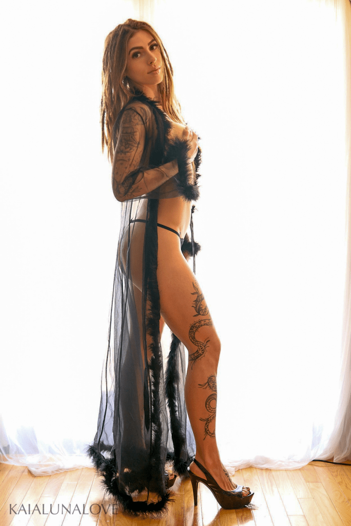 In front of curtains in lingerie