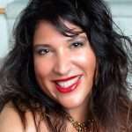 Sacha smiling with big red lips