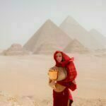 Standing in front of the pyramids of Ejypt