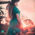 Grace Fonda holding a bit of wood