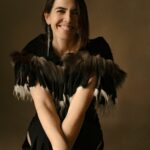 Janelle wearing feathers on her dress