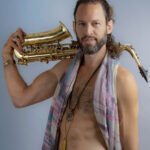 Jehiah with a saxophone