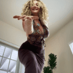 Shari James gesturing towards the camer