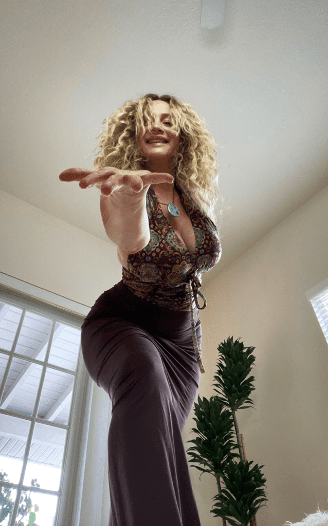 Shari James gesturing towards the camer