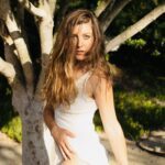 Scarlet Lili in a white dress out in nature