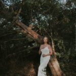 Anastasia Allington standing by a tree