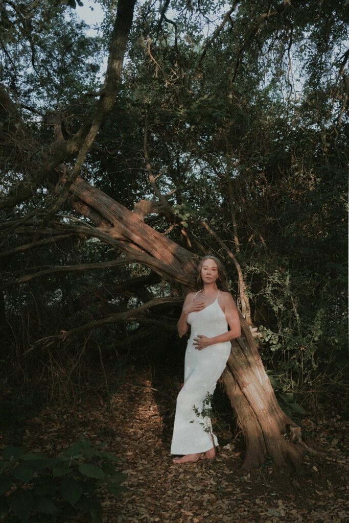 Anastasia Allington standing by a tree