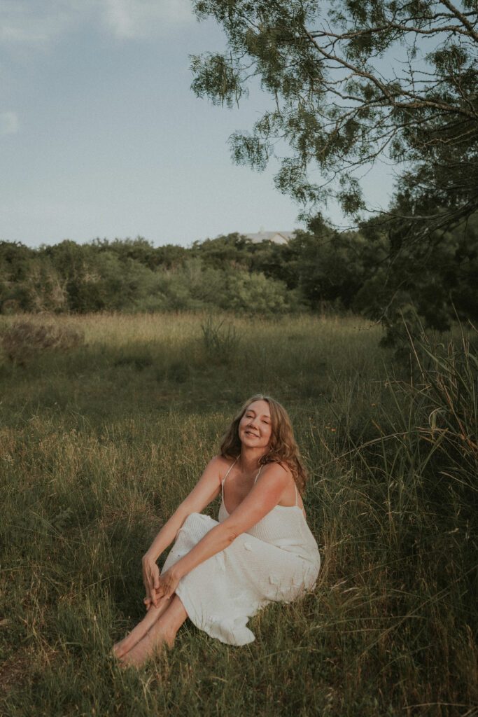 Anastasia Allington sitting in the grass