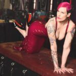 On all 4's in a red dress