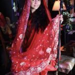 Gina Marie dressed in red coverings