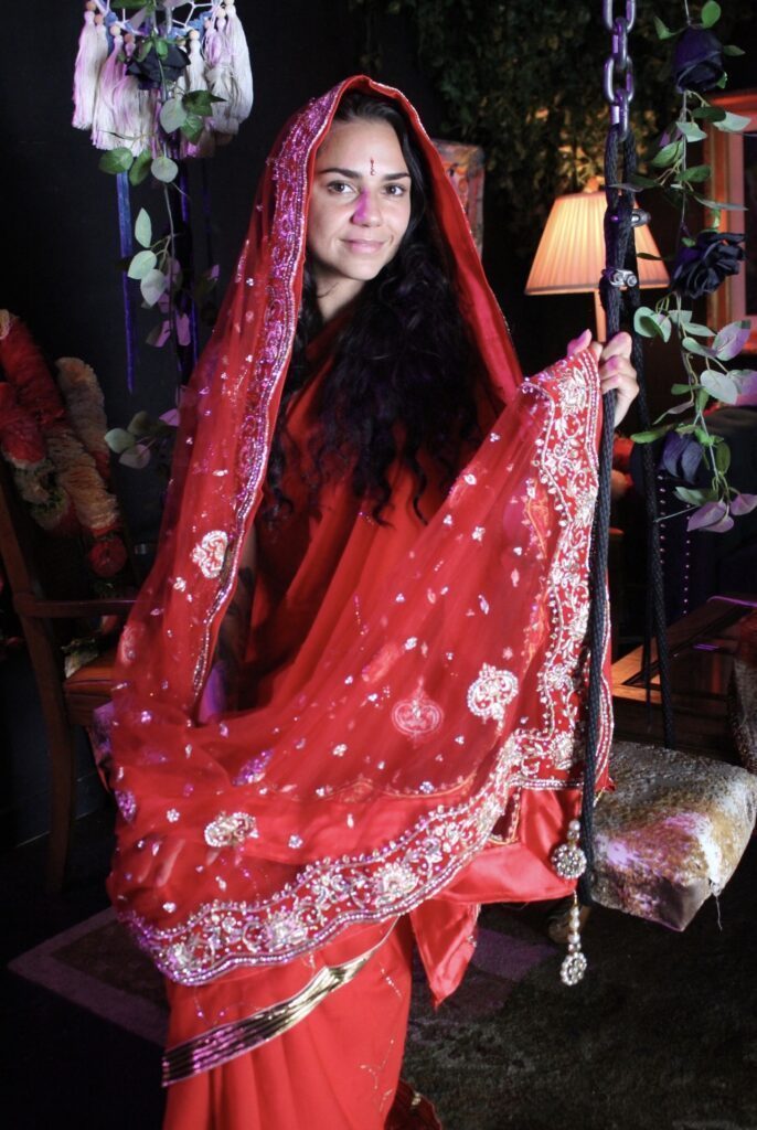 Gina Marie dressed in red coverings
