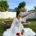 Ellie Gonzalez ina white wedding dress