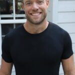 Devah Curlechéile standing in a black shirt