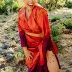 Ishtar Andara in a red dress