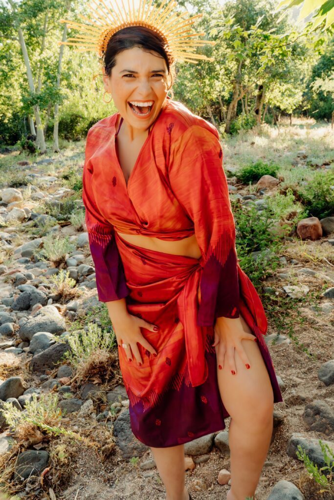 Ishtar Andara in a red dress