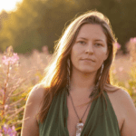 Priestess Hannah surrounded by tall grass