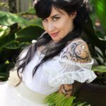 Kat V in a white dress