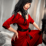 Kat V in a red dress