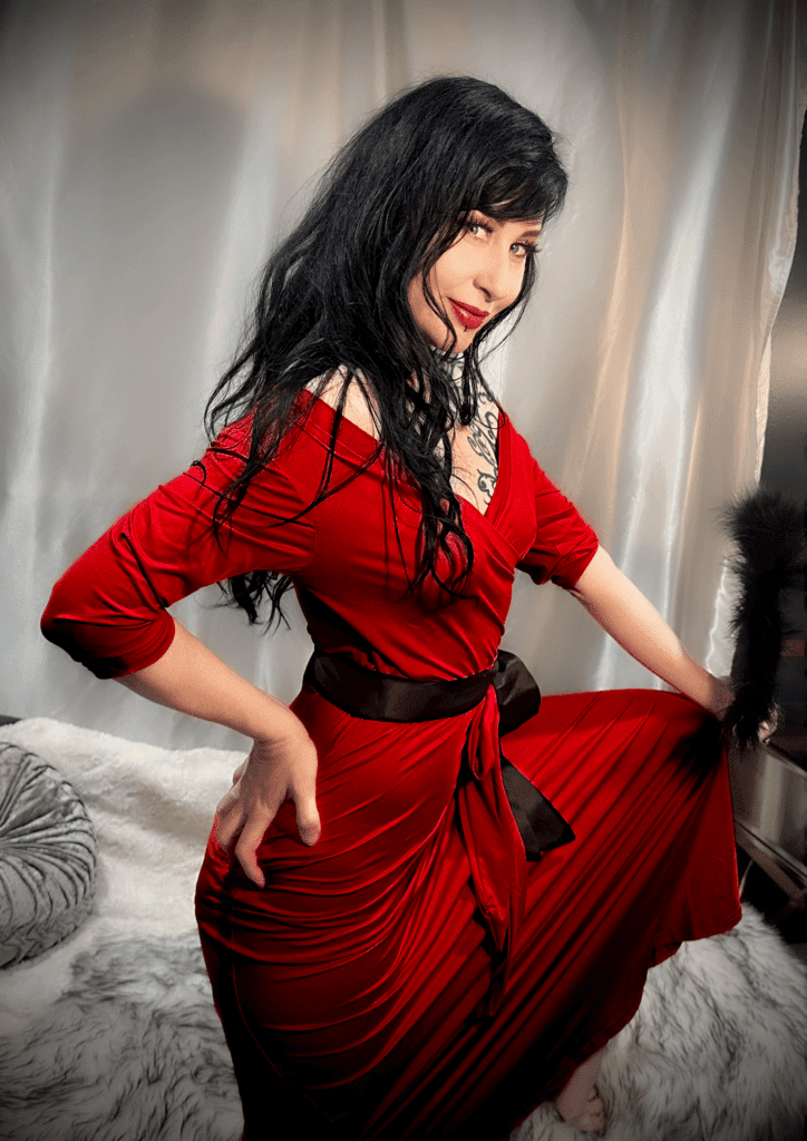 Kat V in a red dress