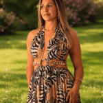Andrea in a park wearing a long black-white patterned dress