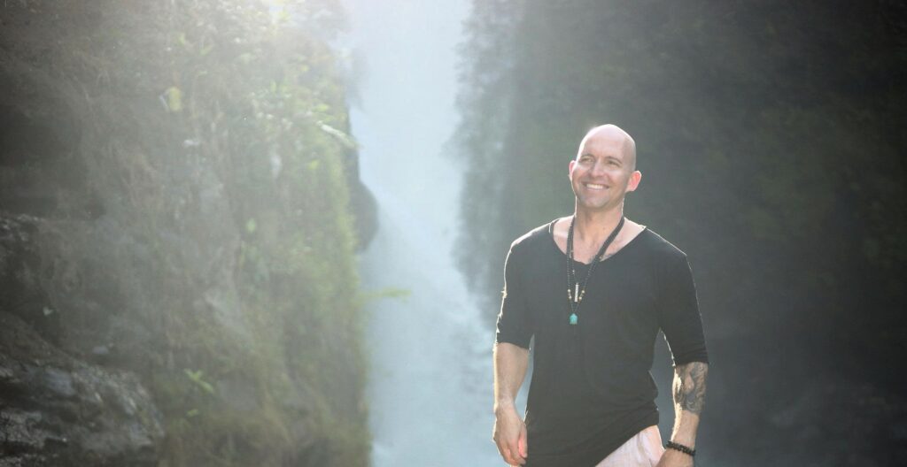Standing in front of a waterfall