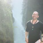 Standing in front of a waterfall